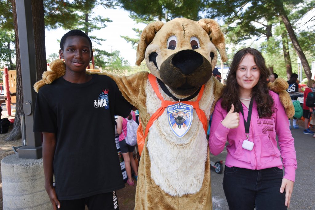 A photo of Ready the Prepared Puppy with friends at the Concord Connections Coalition Back-to-School Event at Keach Park.