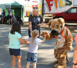 A photo of Ready the Prepared Puppy greeting children at the Hopkinton Fair.