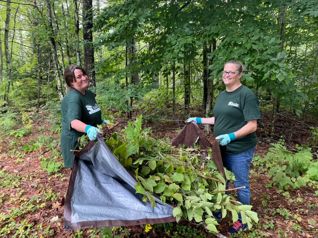 A photo of Community Liaisons Jill Piwoski and Amy Carter at Bear-Paw Regional Greenways in Nottingham as part of the Granite United Way Day of Caring.