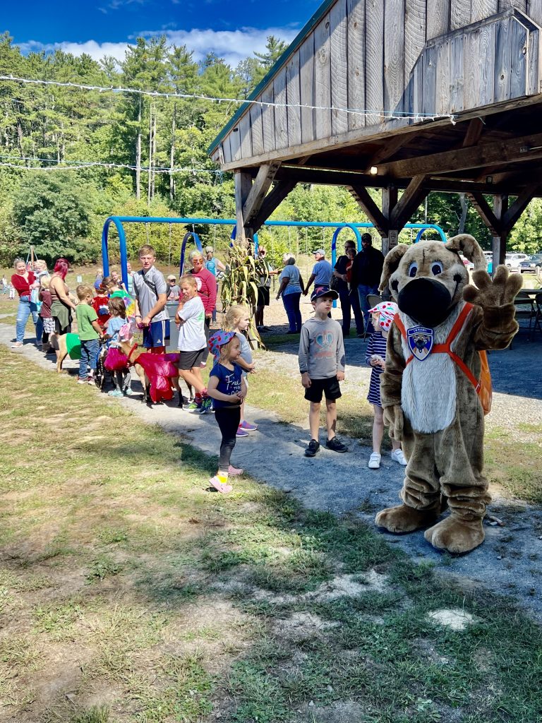 A photo of Ready the Prepared Puppy leading the Kids Parade at the Lee Town Fair.